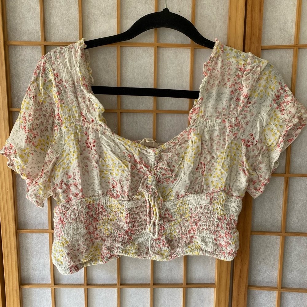 Multi colored floral top. Brand is Sim & Sam, size Large.